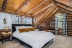 Upper level lofted master bedroom has a queen bed